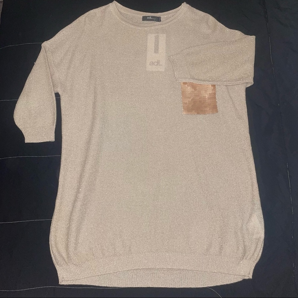Woman’s gold blouse brand new size small